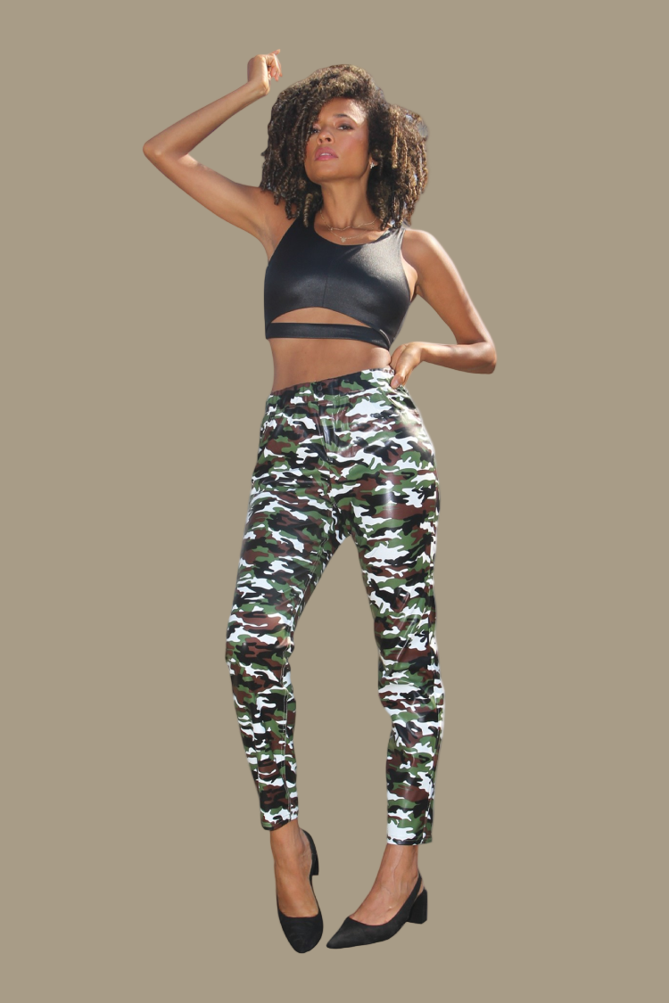 Model wearing camouflage faux leather pants, front-facing hero pose highlighting bold camo pattern, stretch fit, and statement streetwear look by For Her NYC