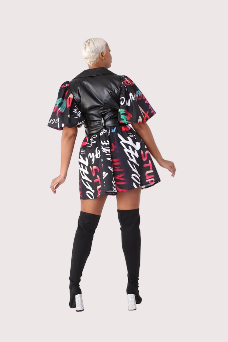 Back view of black multi printed dress with faux leather puff sleeves – For Her NYC