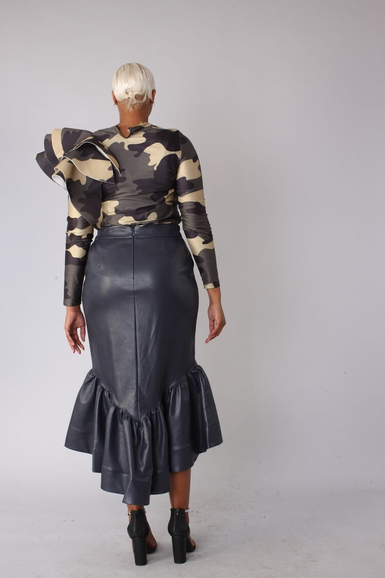 Navy grey faux leather ruffle midi skirt shown back view hands down.