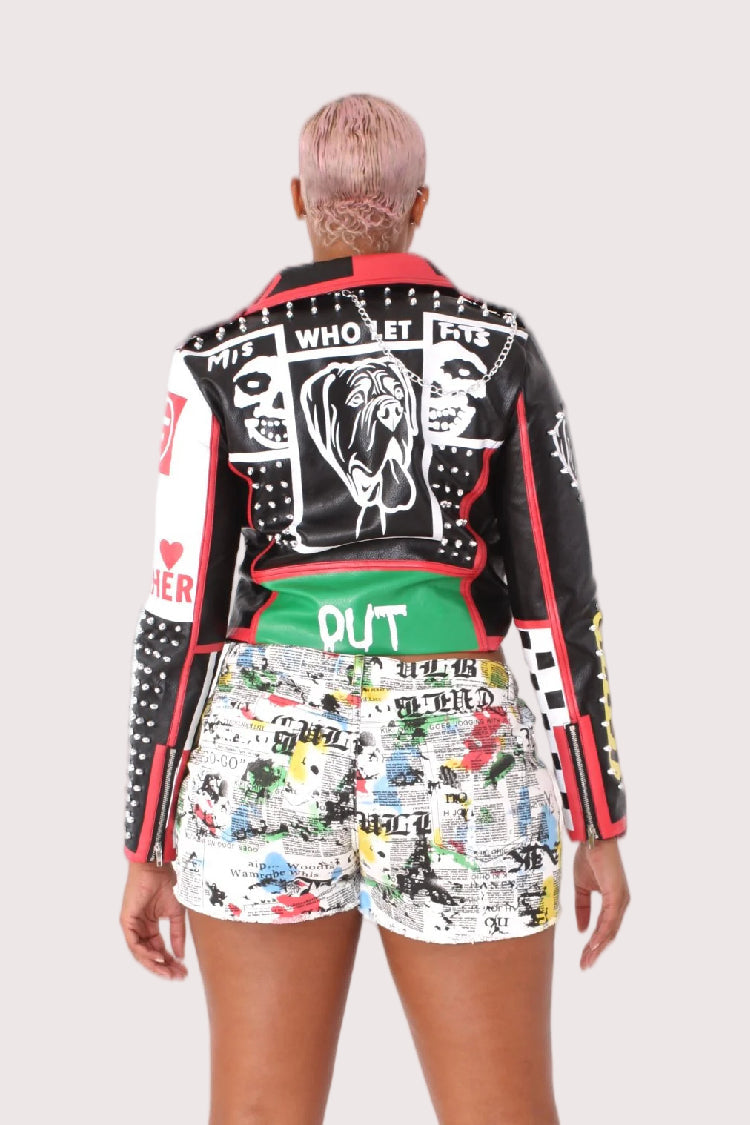 Model wearing black and red moto faux leather jacket, back view highlighting graphic paneling and urban moto-inspired design by For Her NYC