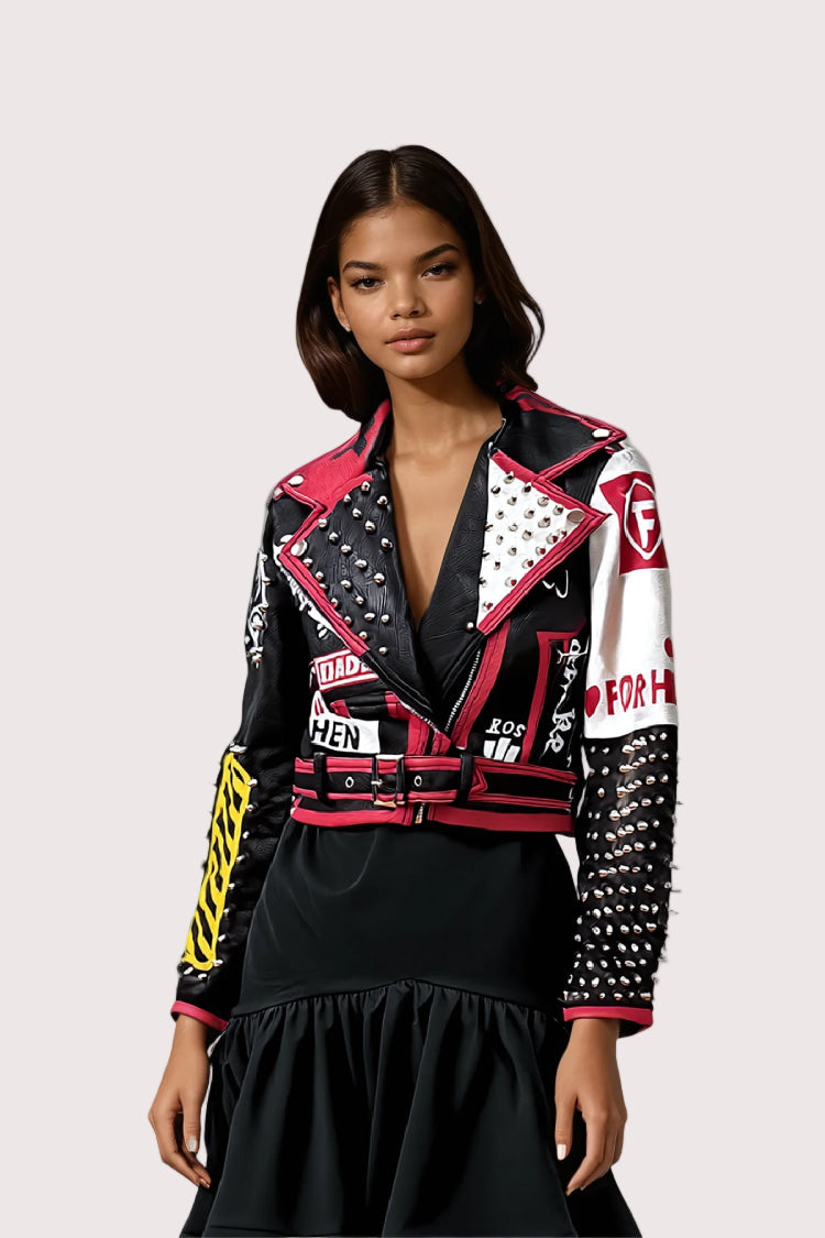Model wearing black and red moto faux leather jacket, front-facing hero pose highlighting bold contrast graphics and edgy moto styling by For Her NYC