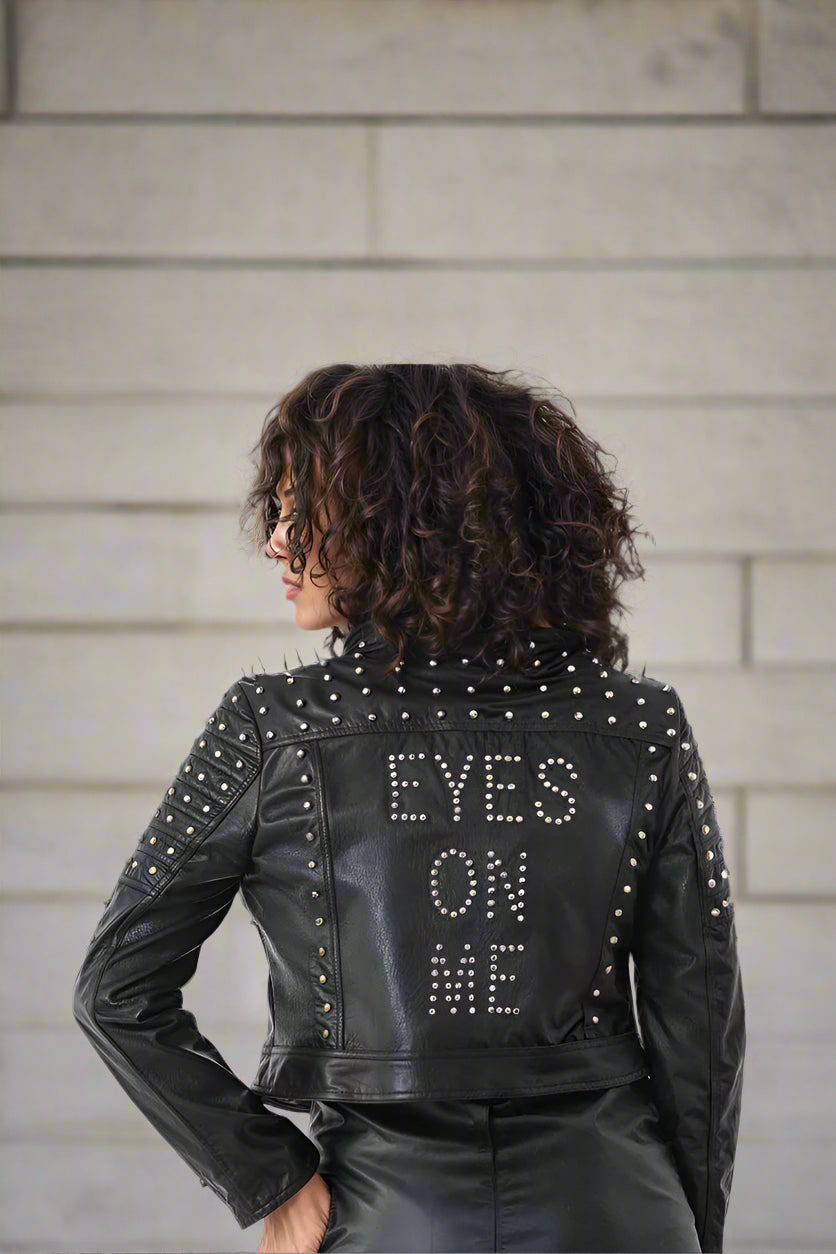 Black multi-colored studded leather moto jacket back view with “Eyes On Me” stud detailing – For Her NYC