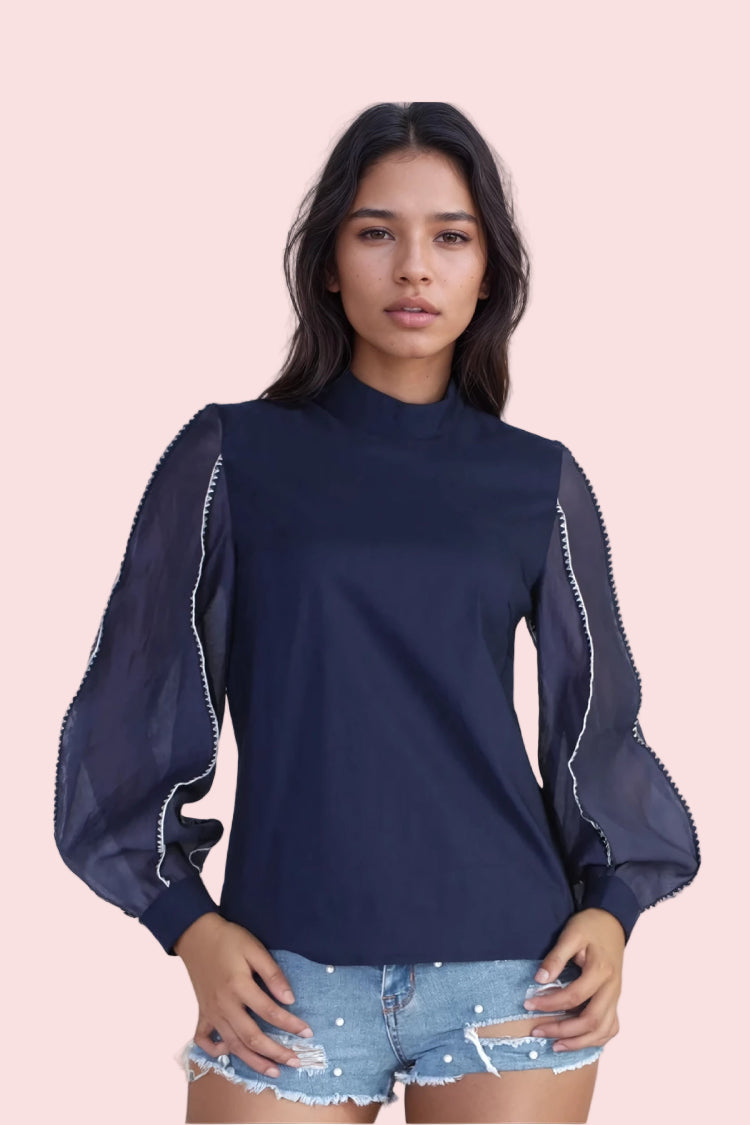Navy elegant puff sleeve blouse with sheer sleeves and delicate white contrast stitching trim, featuring a high neck and polished feminine silhouette.
