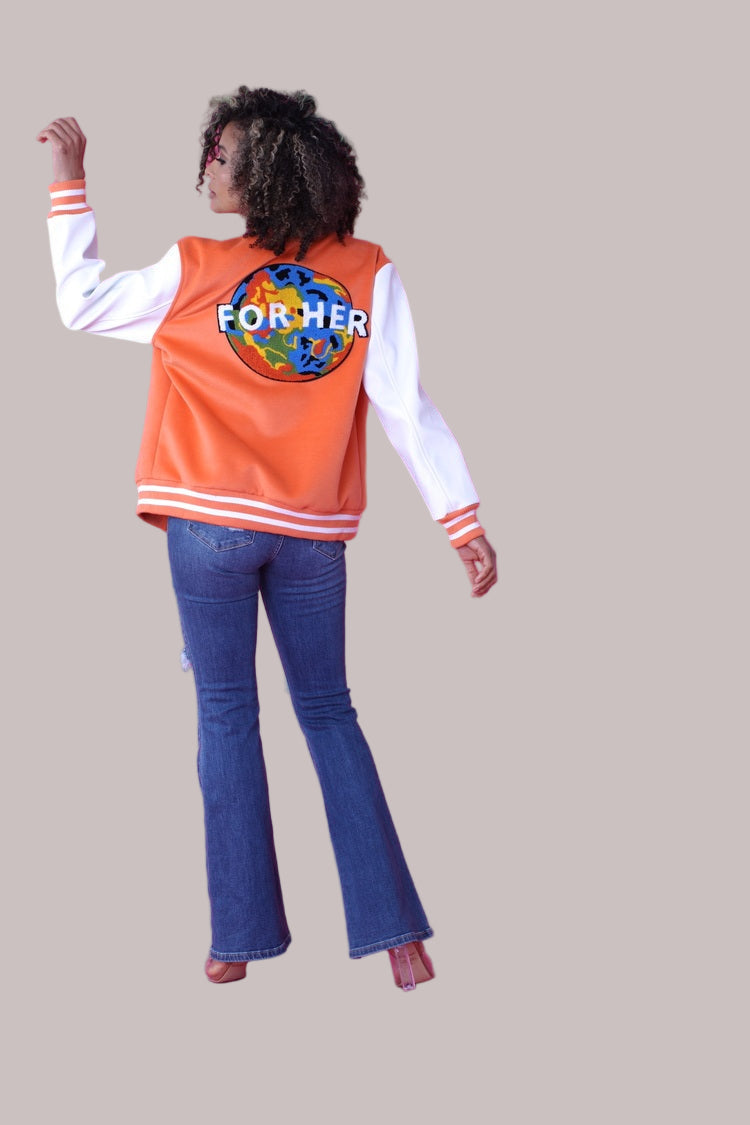 alt text: Back view of orange varsity jacket with FH embroidery – For Her NYC