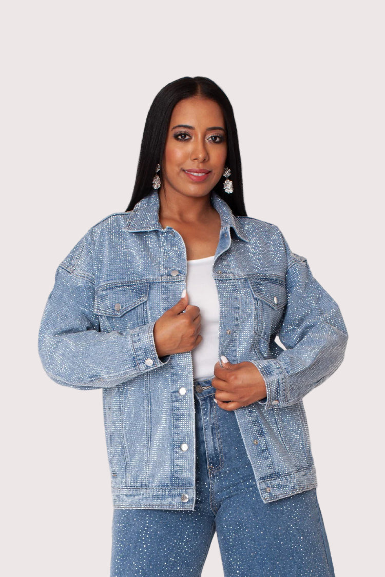 Oversized rhinestone denim jacket front view featuring sparkling cascading embellishments and bold statement design.