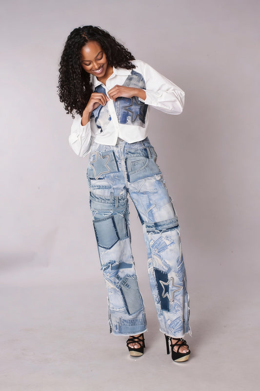 Light wash patchwork distressed straight-leg denim jeans, model standing front wearing white top, For Her NYC