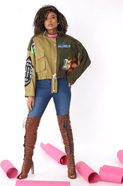 Army green patchwork utility woven jacket with embroidered patches and button pockets, front full view styled casually by For Her NYC