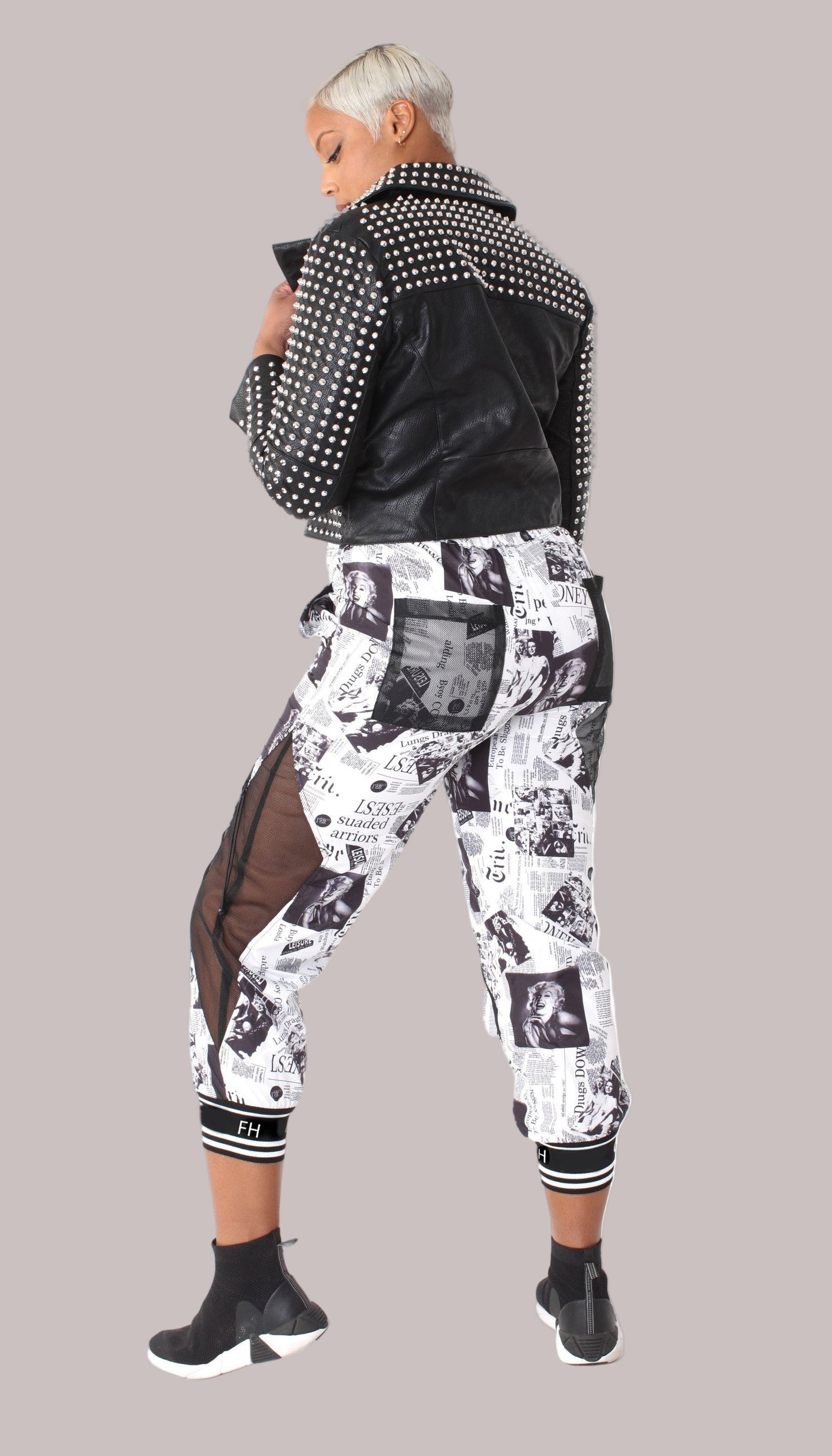back view of printed mesh patchwork joggers showcasing mesh patch panels