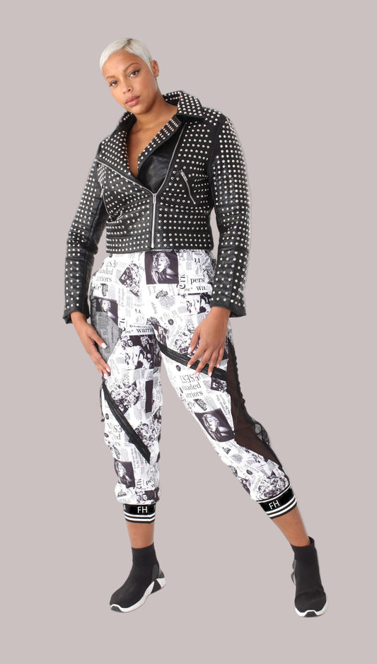 front view of printed mesh patchwork joggers styled with studded moto jacket