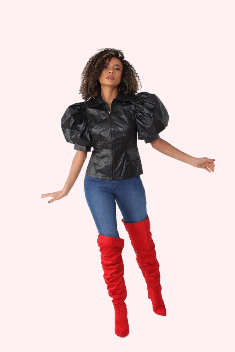 Black puff sleeve faux leather jacket front view with confident stance and dramatic puff sleeves by For Her NYC