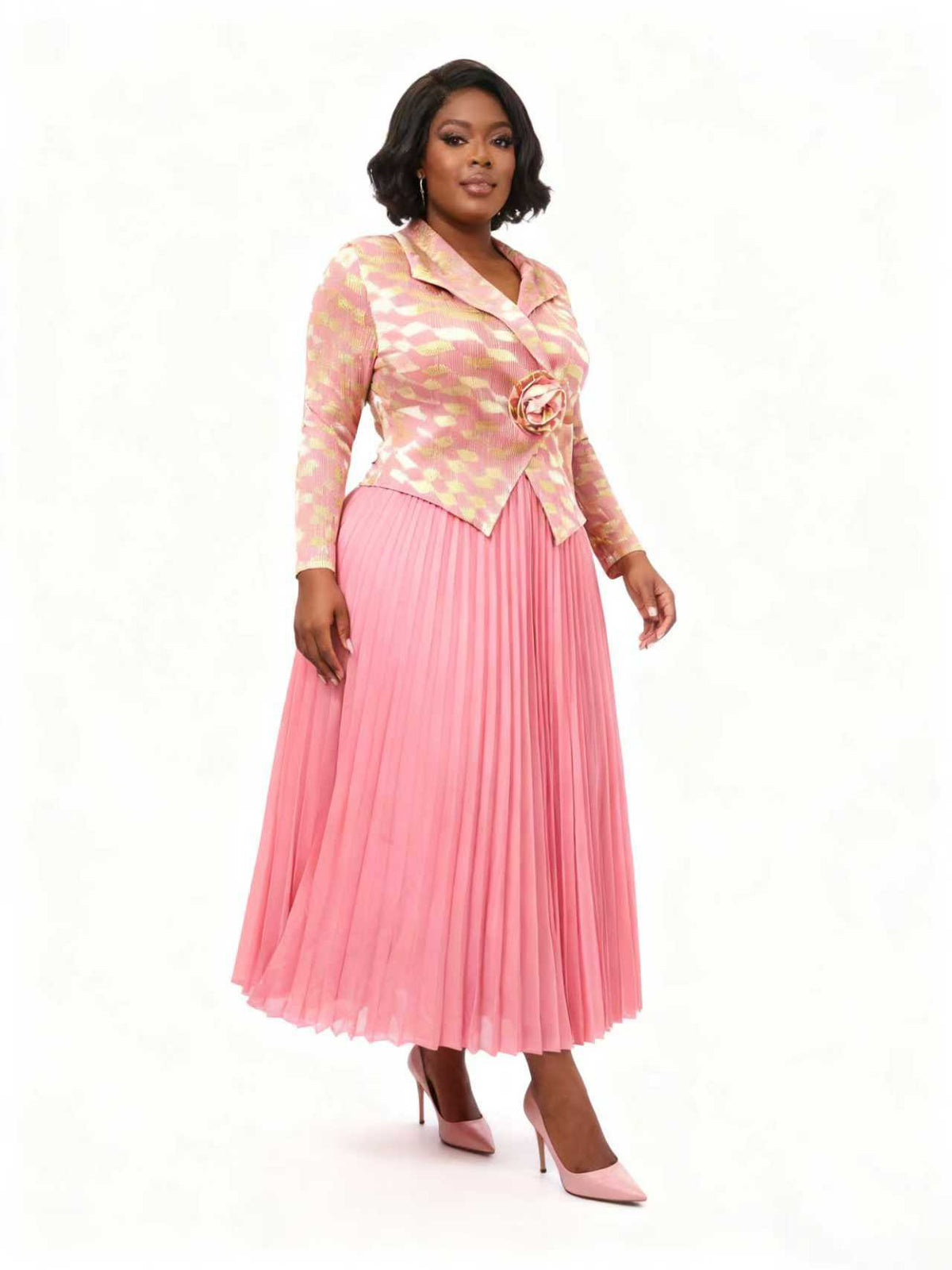 Raspberry rhombus pleated skirt suit with patterned jacket and pleated midi skirt, model standing front, For Her NYC