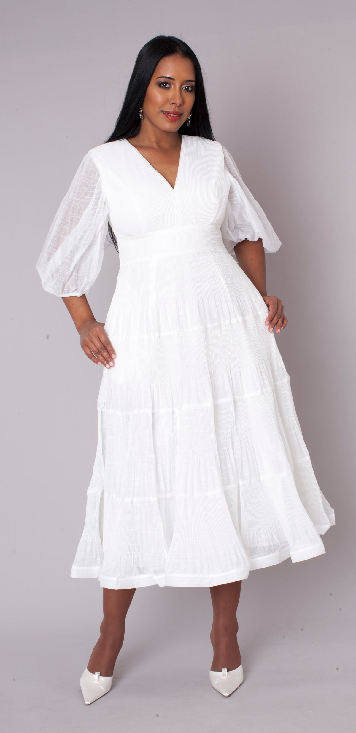 White tiered maxi dress in motion perfect for special occasions