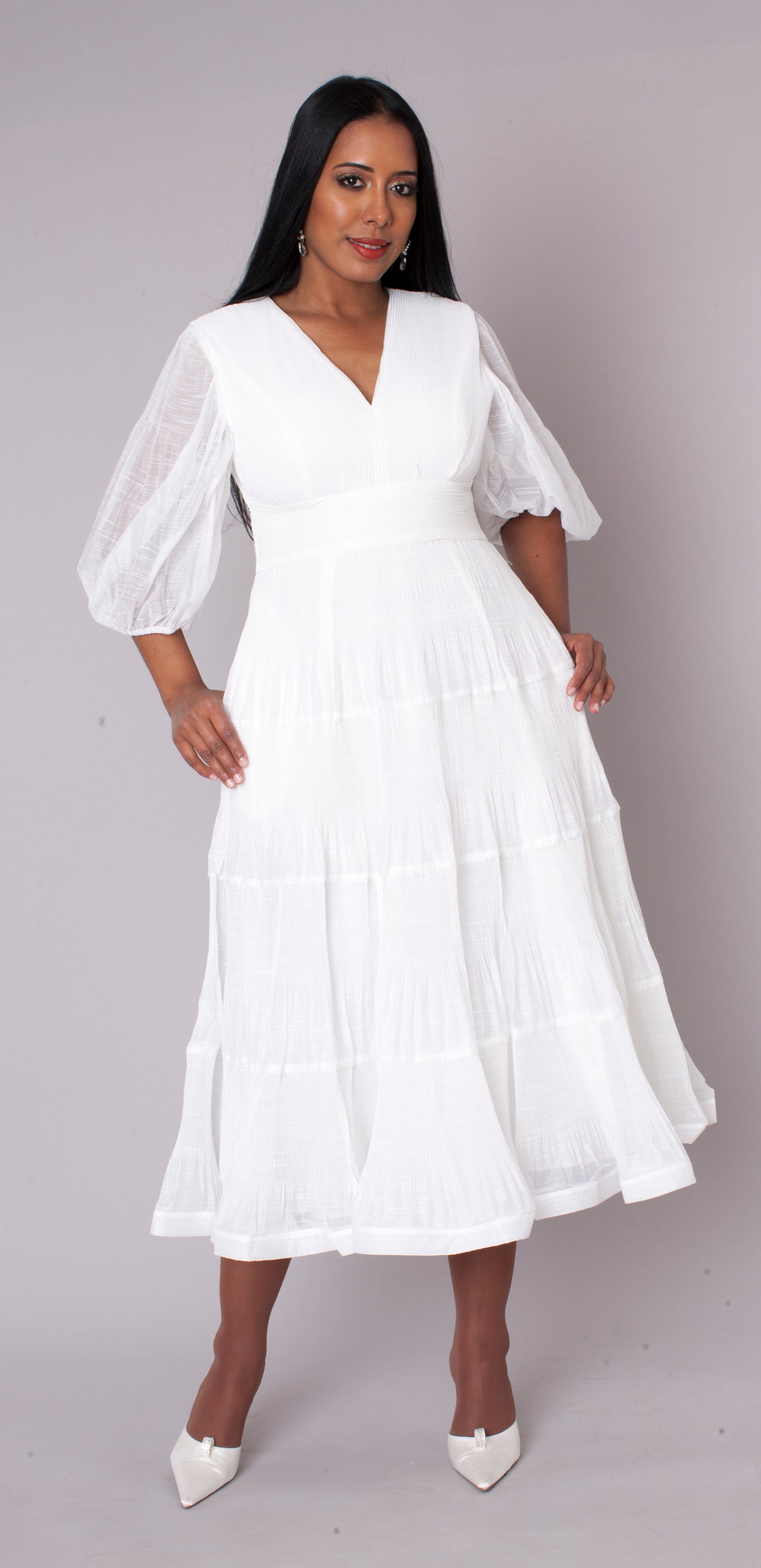 White tiered maxi dress in motion perfect for special occasions