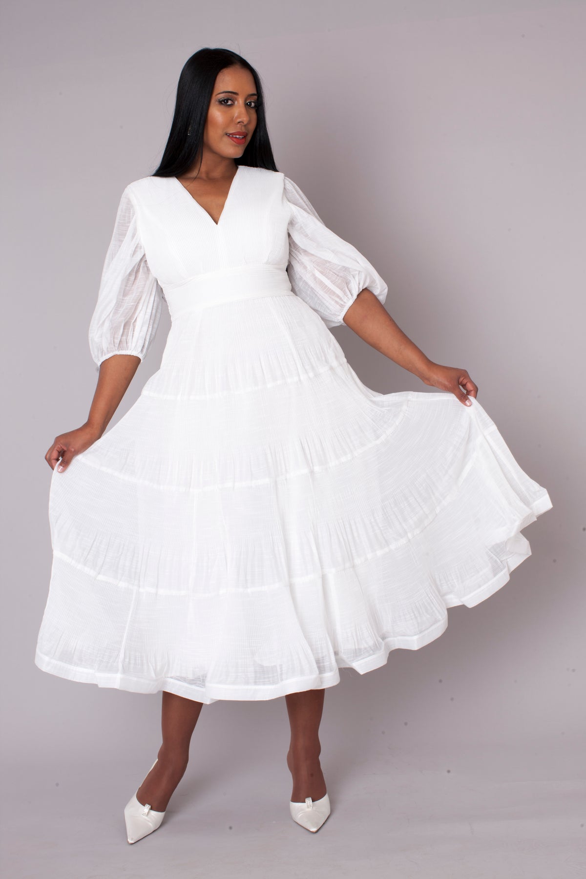 White tiered maxi dress in motion perfect for special occasions