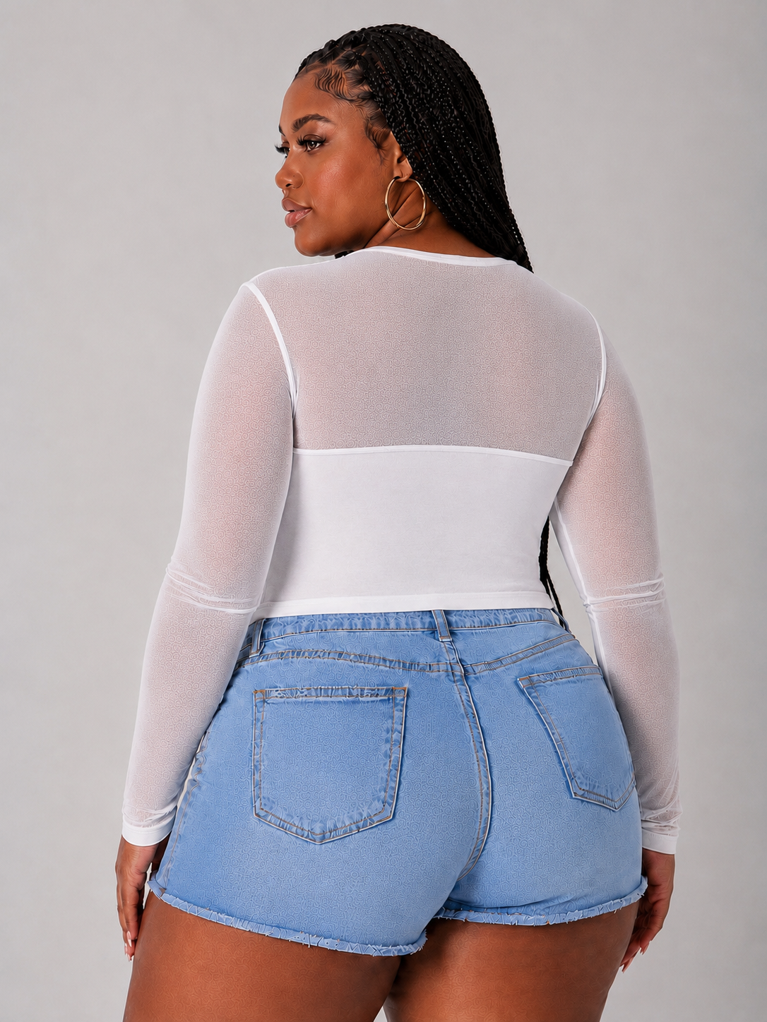 model wearing the For Her NYC Style 82198 white sheer mesh long sleeve top featuring an allover rhinestone front panel and semi-sheer sleeves.