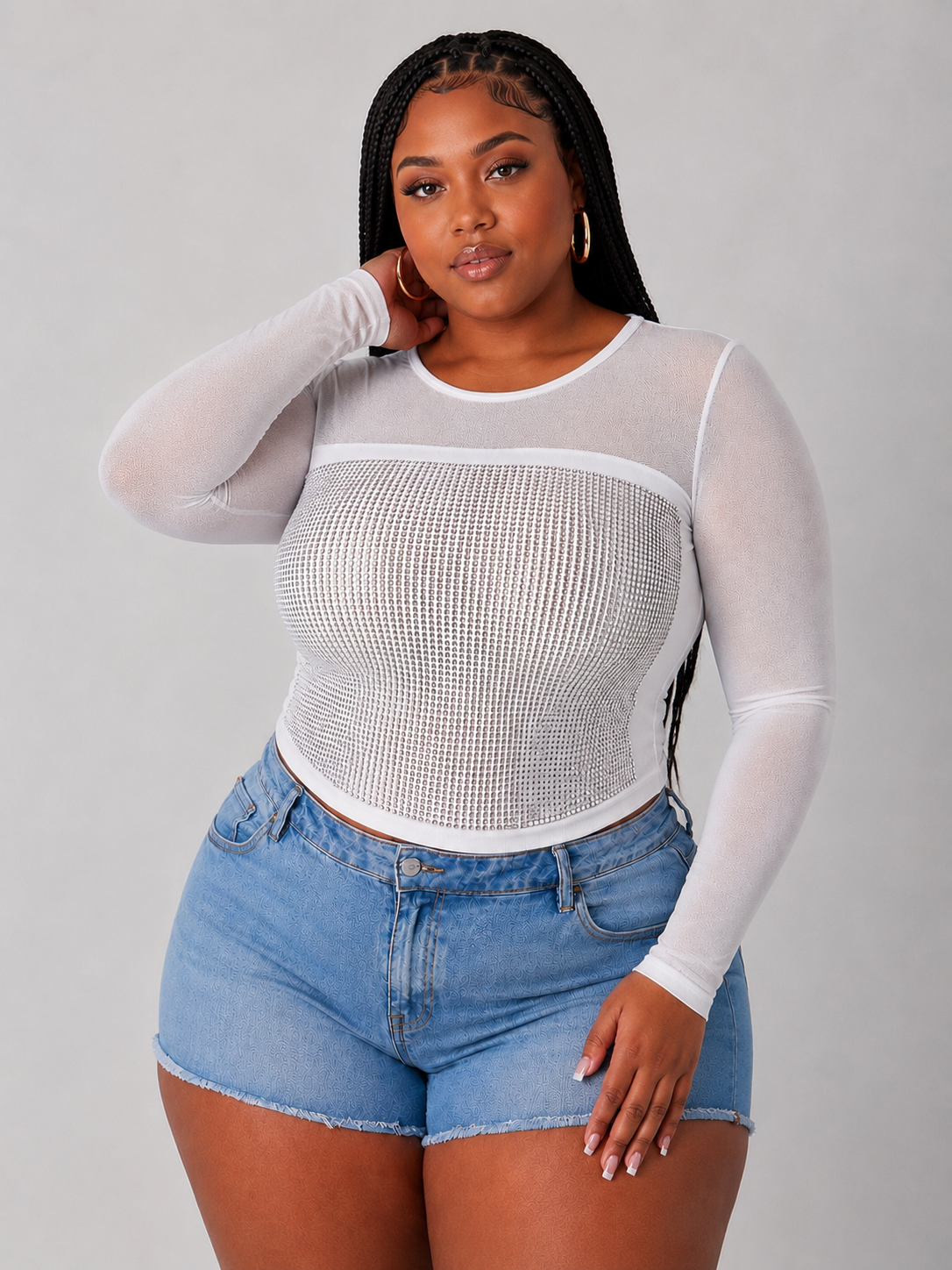model wearing the For Her NYC Style 82198 white sheer mesh long sleeve top featuring an allover rhinestone front panel and semi-sheer sleeves.