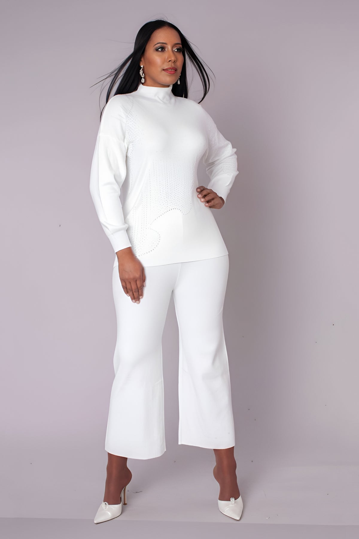 Front view of white knit pantset with long sleeves and relaxed silhouette, For Her NYC