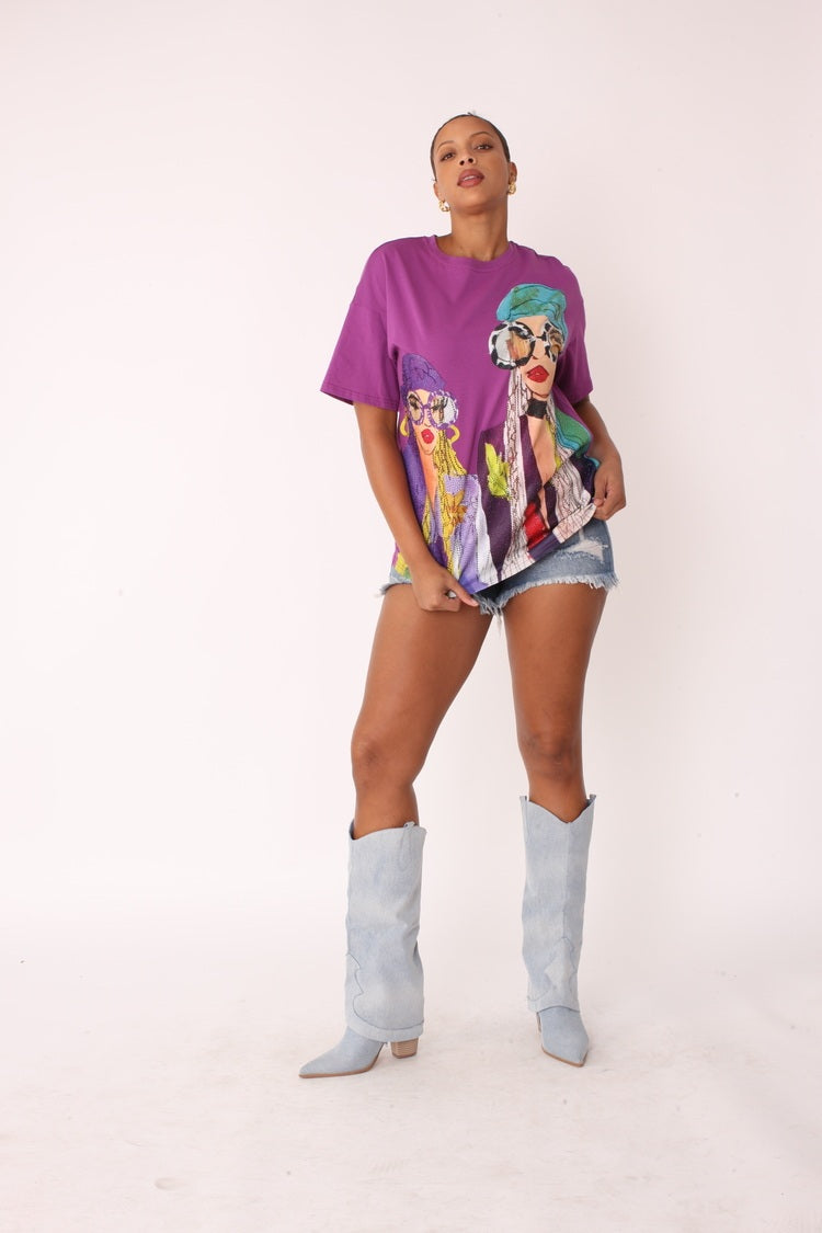 Purple multi street style graphic tee shown in front walking pose highlighting relaxed silhouette and vibrant print, For Her NYC