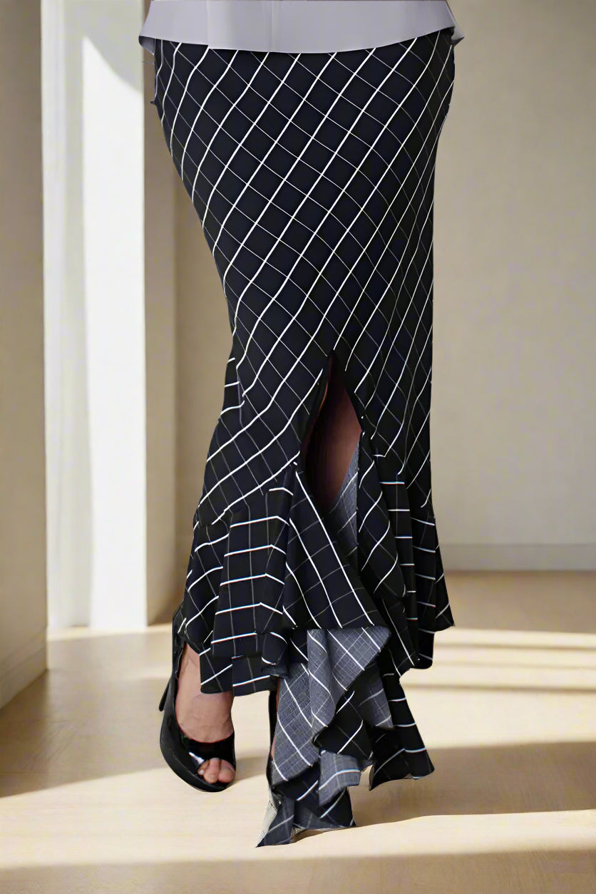 Black and white striped asymmetrical maxi skirt with flowing high-low hem, front view.