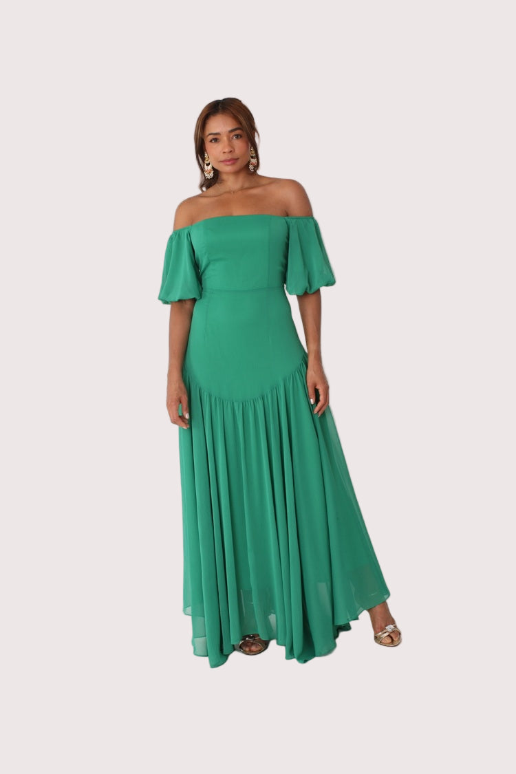 Emerald off-shoulder maxi dress shown front standing view, flowing silhouette and ruffle detail, For Her NYC