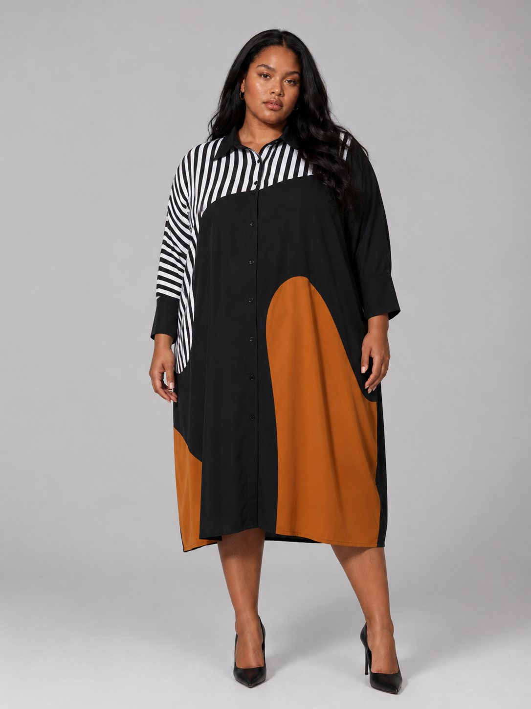 Plus size model wearing the Tally Taylor Bold Colorblock Shirt Dress in black, burnt orange, and striped accents, style U0365W.