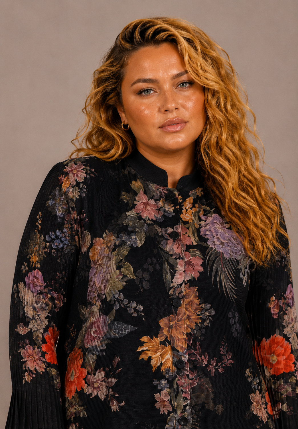 Close-up of a plus size model wearing the Tally Taylor Spring Garden Print Tunic Pant Set, highlighting the black multicolor floral print, button front and neckline, style S0105W.