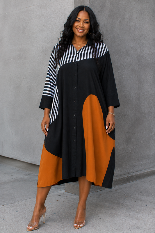 For Her NYC Bold Colorblock Shirt Dress in Black and Camel featuring mixed stripe and colorblock panels, a button-front silhouette, classic collar, three-quarter sleeves, and a relaxed midi-length fit.