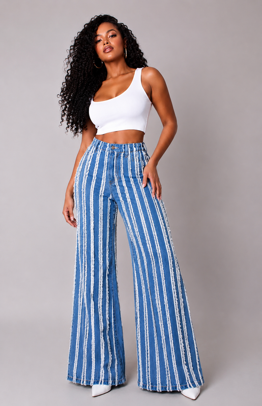 Denim vertical distressed stripe wide-leg jeans with frayed detailing and elongated silhouette front view – For Her NYC